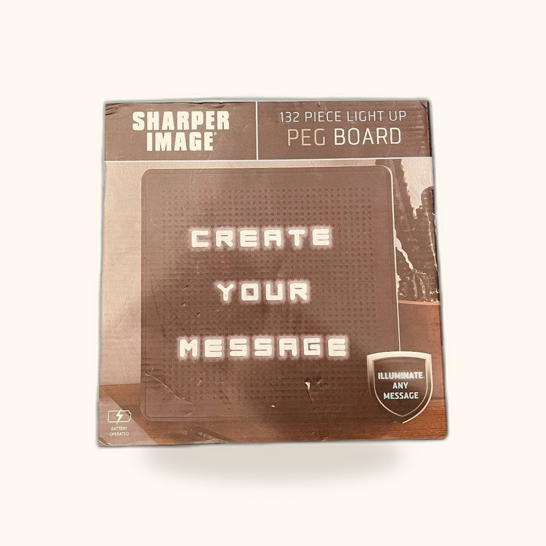 Tablero de mensajes luminoso Sharper Image, 132 piezas